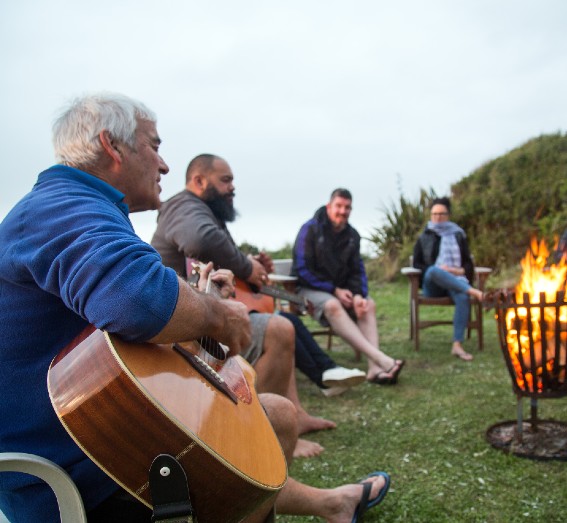 Family sitting around a fire